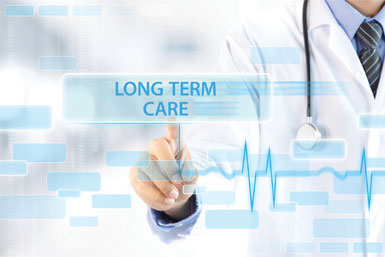 A doctor writes the words "LONG TERM CARE."